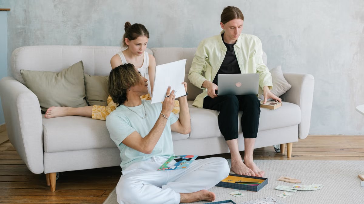 A family of three enjoying togetherness with creative activities in a stylish living room.